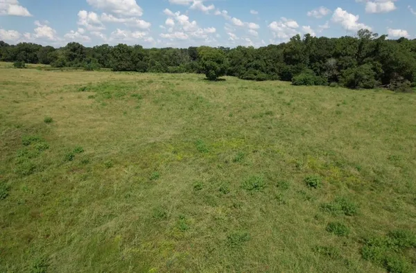 a view of a lake with a yard