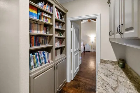 a view of a hallway with bookshelf