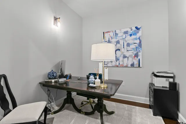 a view of a workspace with furniture