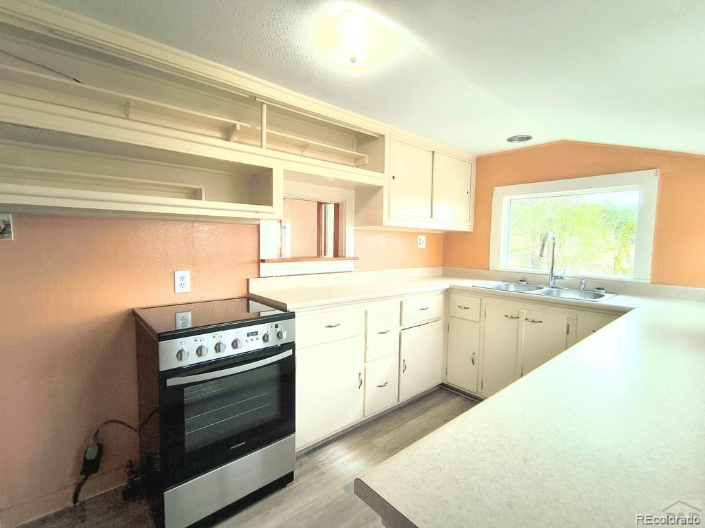8180 Old San Isabel Road Rye, CO 81069 - Photo 12 of 35 a kitchen with a stove oven and sink