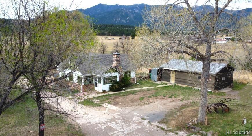 8180 Old San Isabel Road Rye, CO 81069 - Photo 2 of 35 a view of a house with a yard