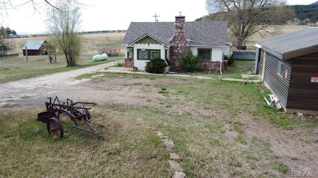 8180 Old San Isabel Road Rye, CO 81069 - Photo 34 of 35 a view of a house with a yard