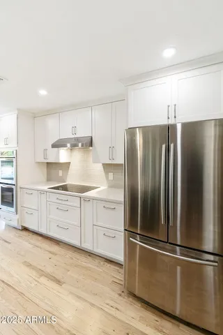 a kitchen with a sink and cabinets