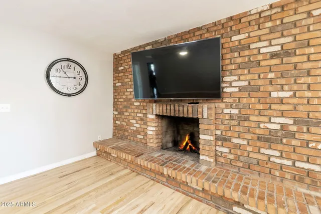 an aerial view of a house with swimming pool and porch
