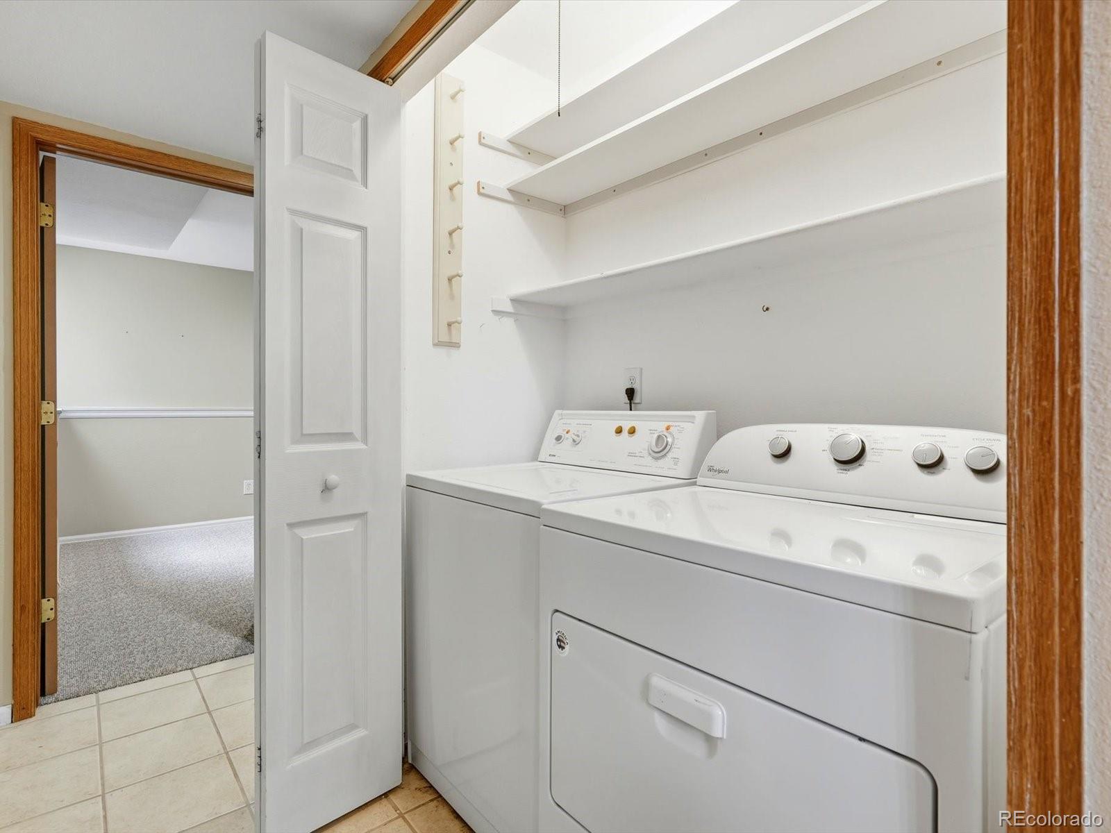 765 Stowe Street Highlands Ranch, CO 80126 - Photo 20 of 43 a utility room with dryer and washer