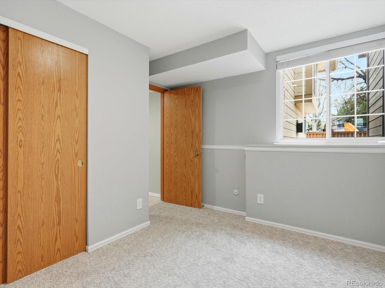 765 Stowe Street Highlands Ranch, CO 80126 - Photo 23 of 43 an empty room with windows