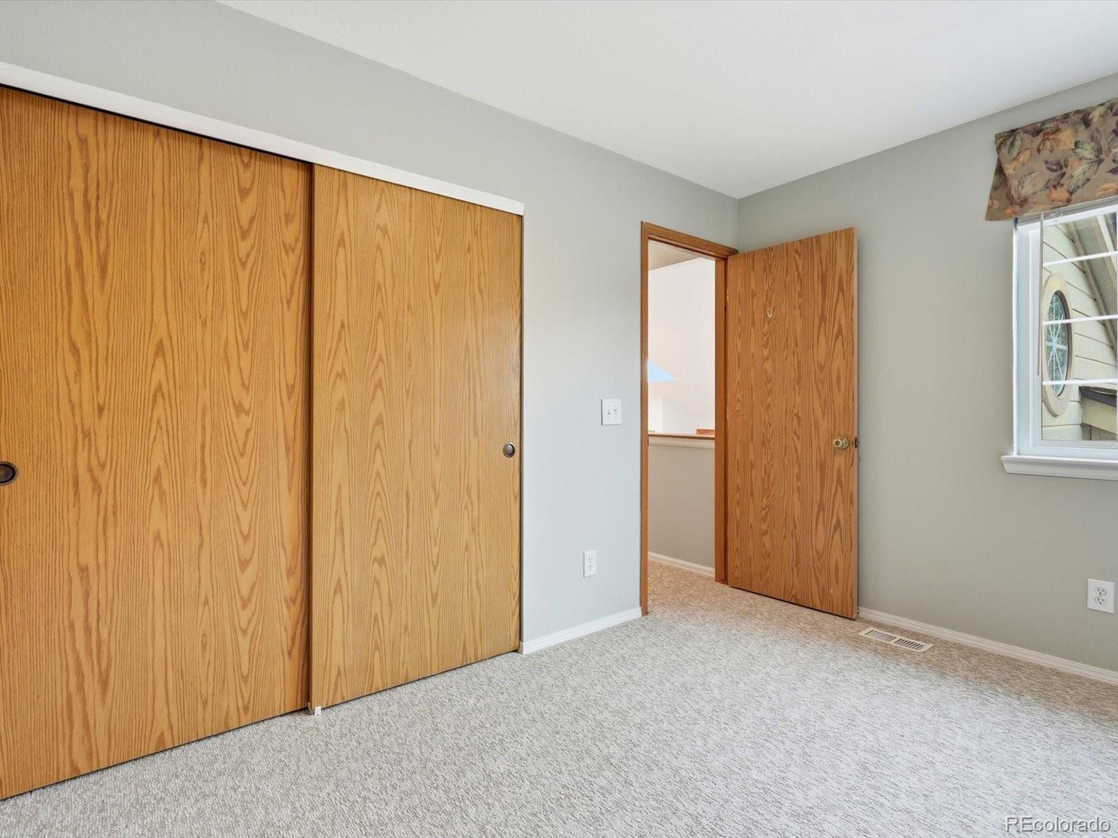 765 Stowe Street Highlands Ranch, CO 80126 - Photo 30 of 43 a view of an empty room with a window