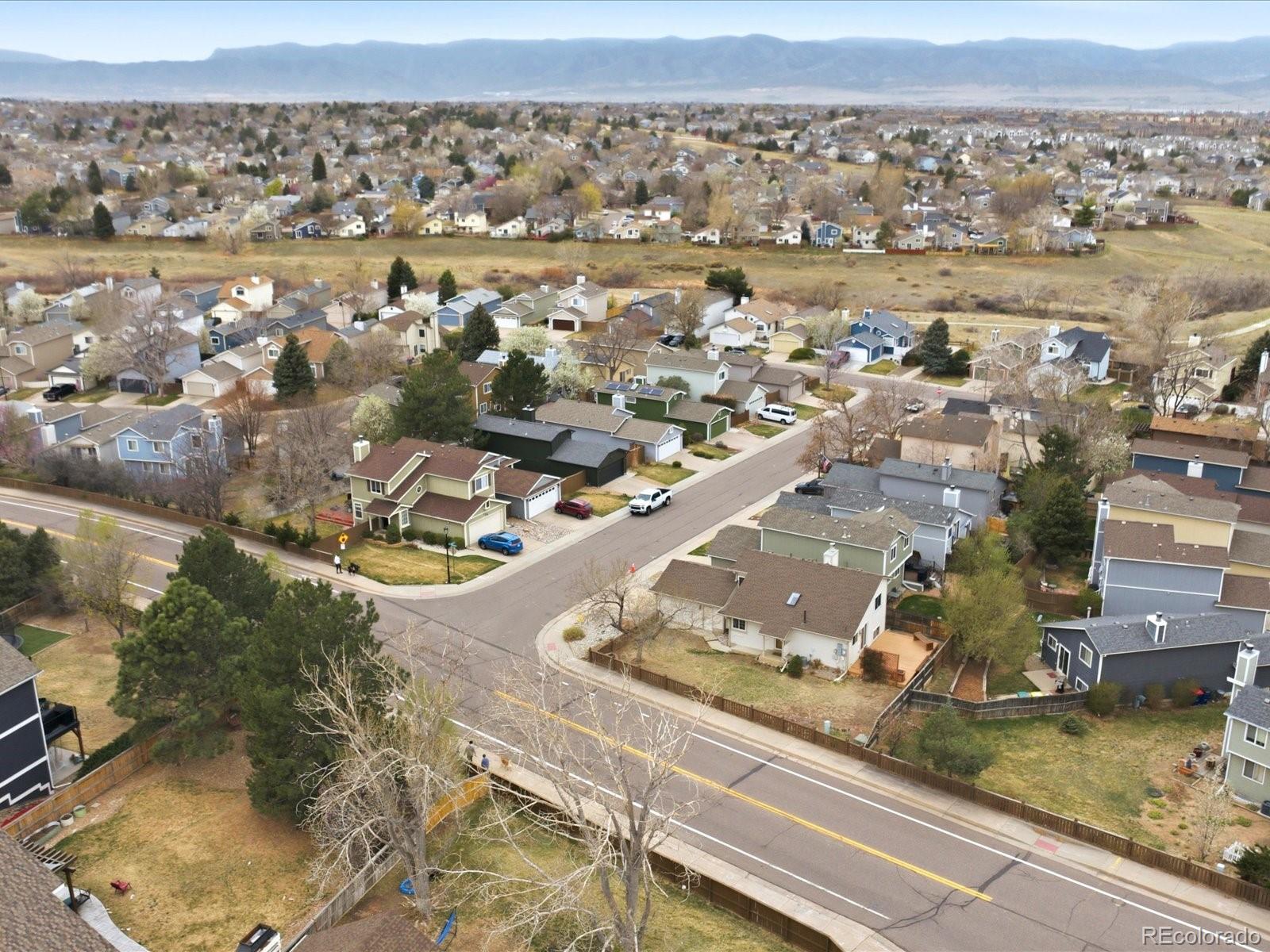 765 Stowe Street Highlands Ranch, CO 80126 - Photo 38 of 43 an aerial view of residential houses with outdoor space