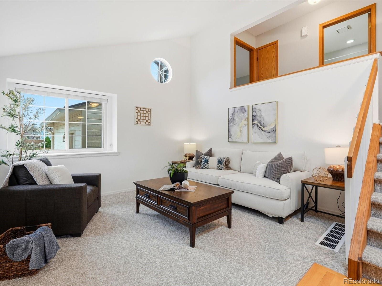 765 Stowe Street Highlands Ranch, CO 80126 - Photo 5 of 43 a living room with furniture and a potted plant