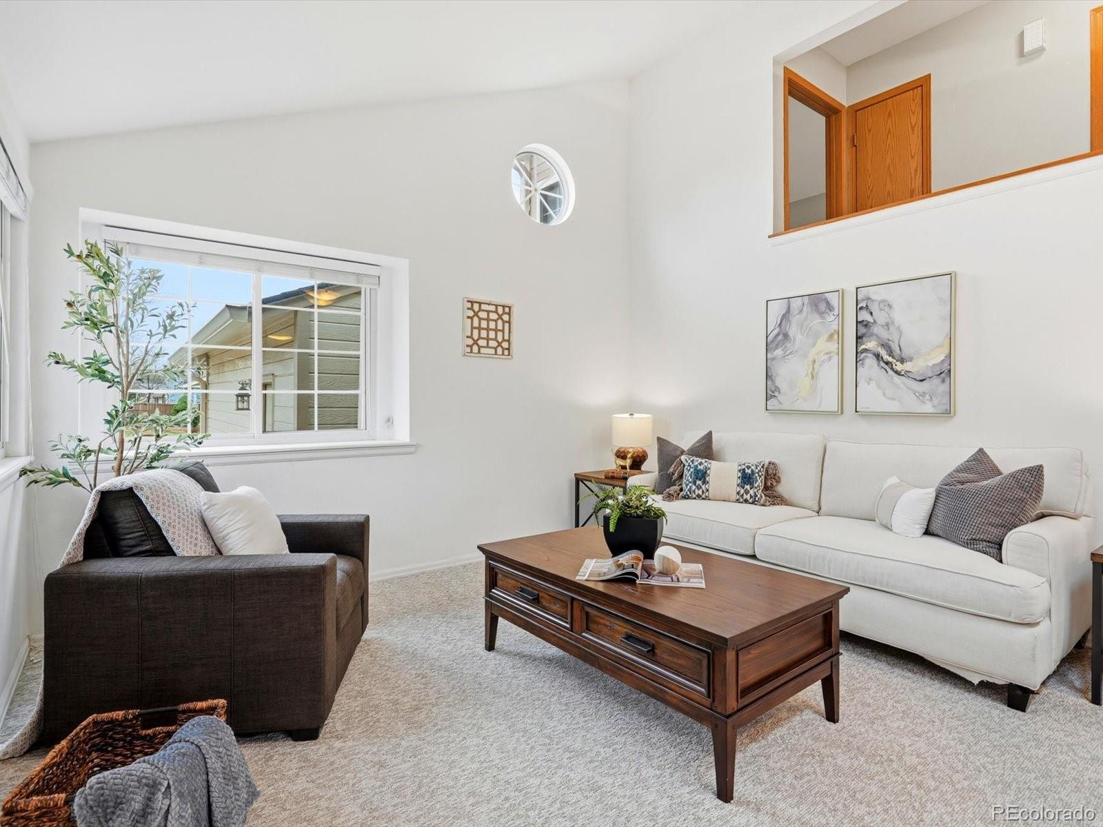 765 Stowe Street Highlands Ranch, CO 80126 - Photo 6 of 43 a living room with furniture and a window