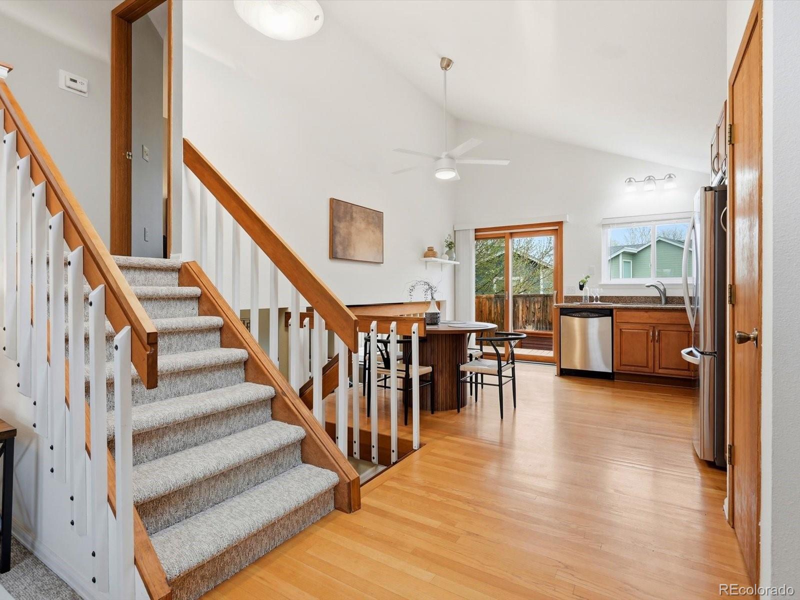 765 Stowe Street Highlands Ranch, CO 80126 - Photo 10 of 43 a view of a livingroom with furniture and a kitchen