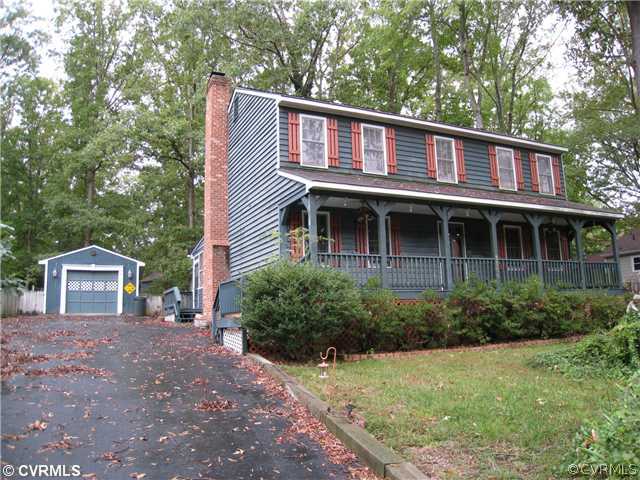 3006 Brookforest Road Midlothian, VA 23112 - Photo 1 of 8 a front view of a house with garden
