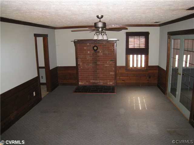 3006 Brookforest Road Midlothian, VA 23112 - Photo 2 of 8 wooden floor in an empty room with a window