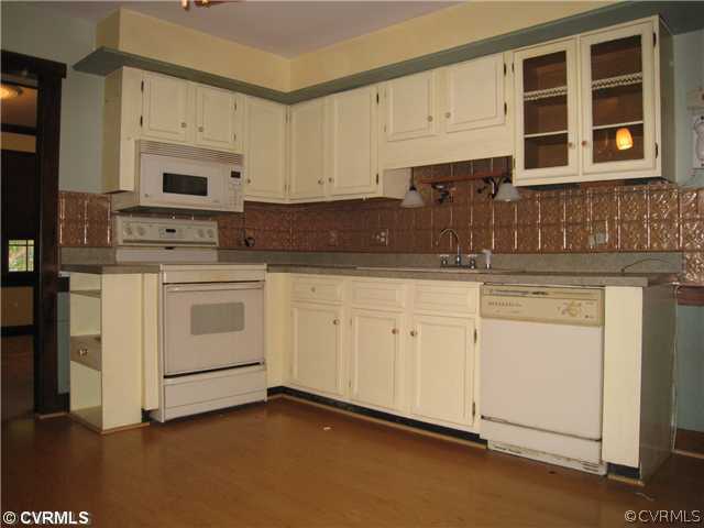 3006 Brookforest Road Midlothian, VA 23112 - Photo 3 of 8 a kitchen with stainless steel appliances granite countertop white cabinets and a refrigerator