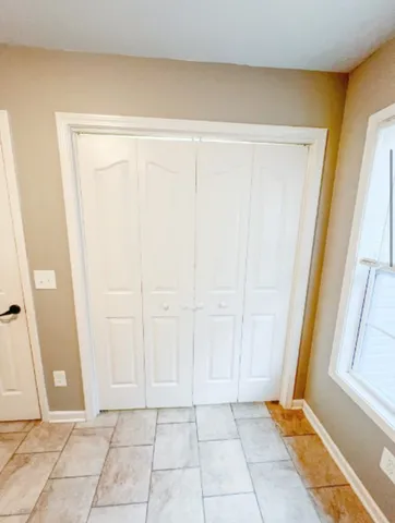 a view of room with window and hardwood floor