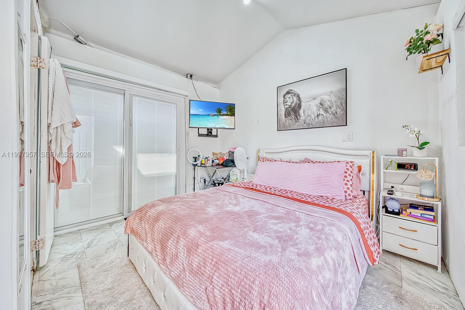 2171 Southwest 21st Street Miami, FL 33145 - Photo 12 of 31 a large white bed in a white room