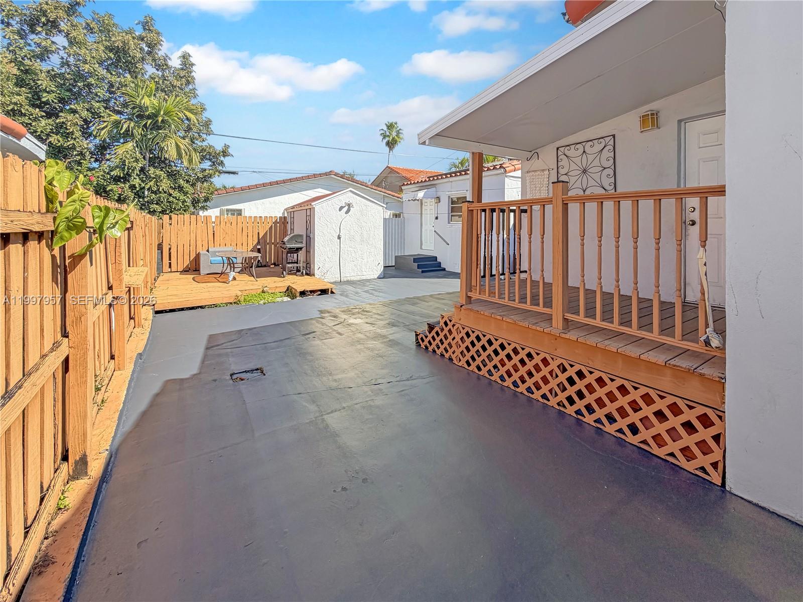 2171 Southwest 21st Street Miami, FL 33145 - Photo 14 of 31 a view of a backyard with a wooden fence