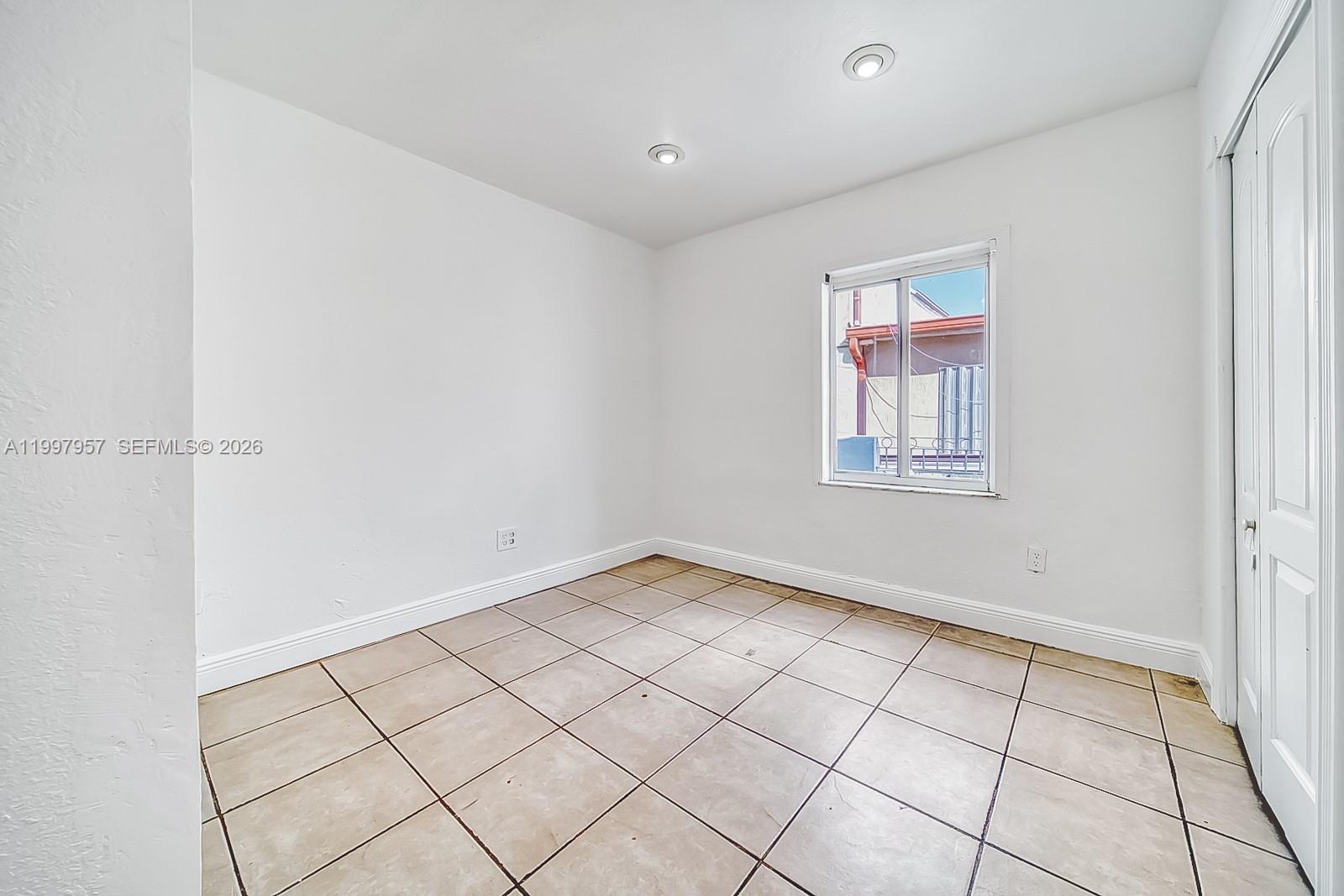 2171 Southwest 21st Street Miami, FL 33145 - Photo 20 of 31 a view of an empty room and window