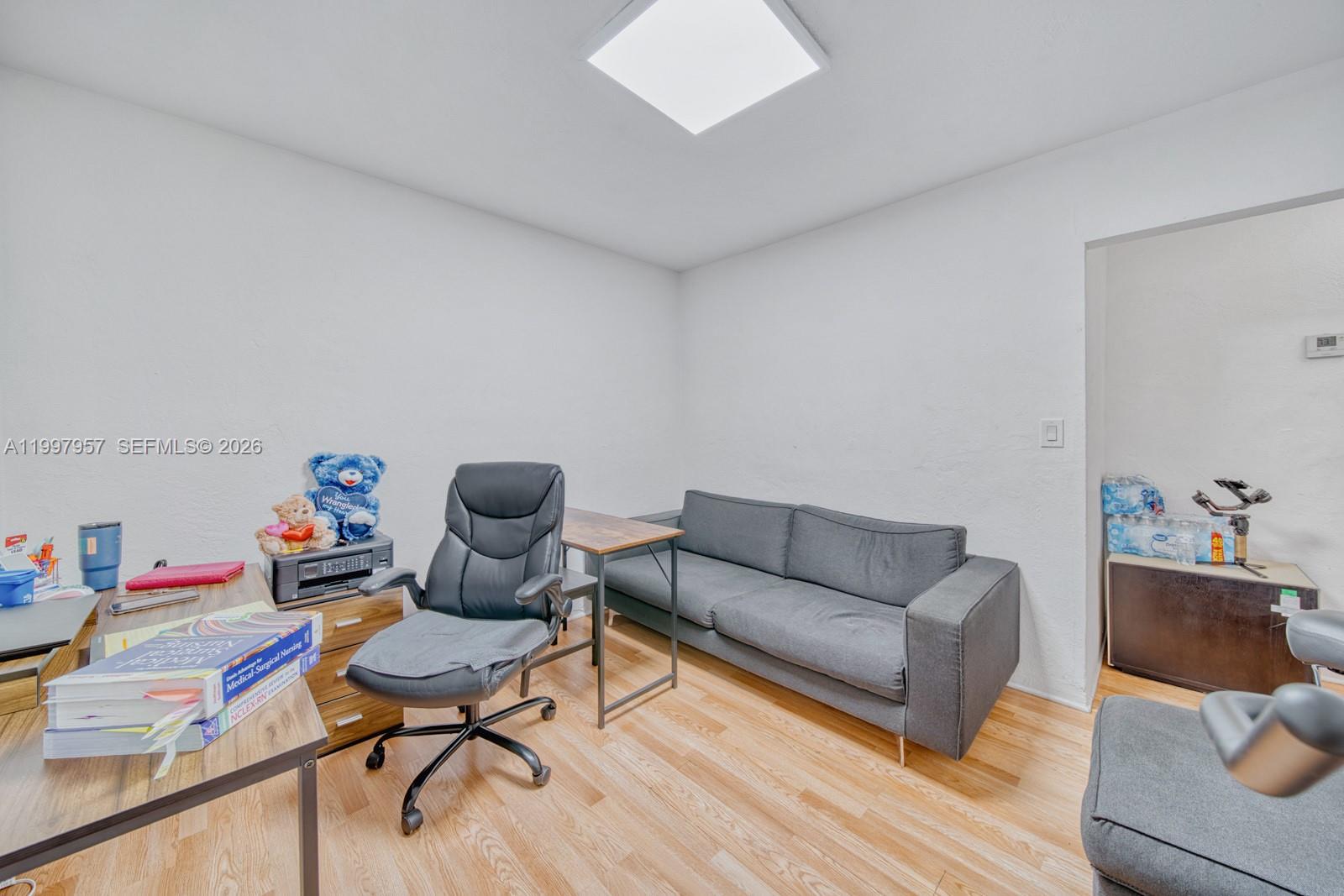 2171 Southwest 21st Street Miami, FL 33145 - Photo 23 of 31 a living room with furniture and a wooden floor