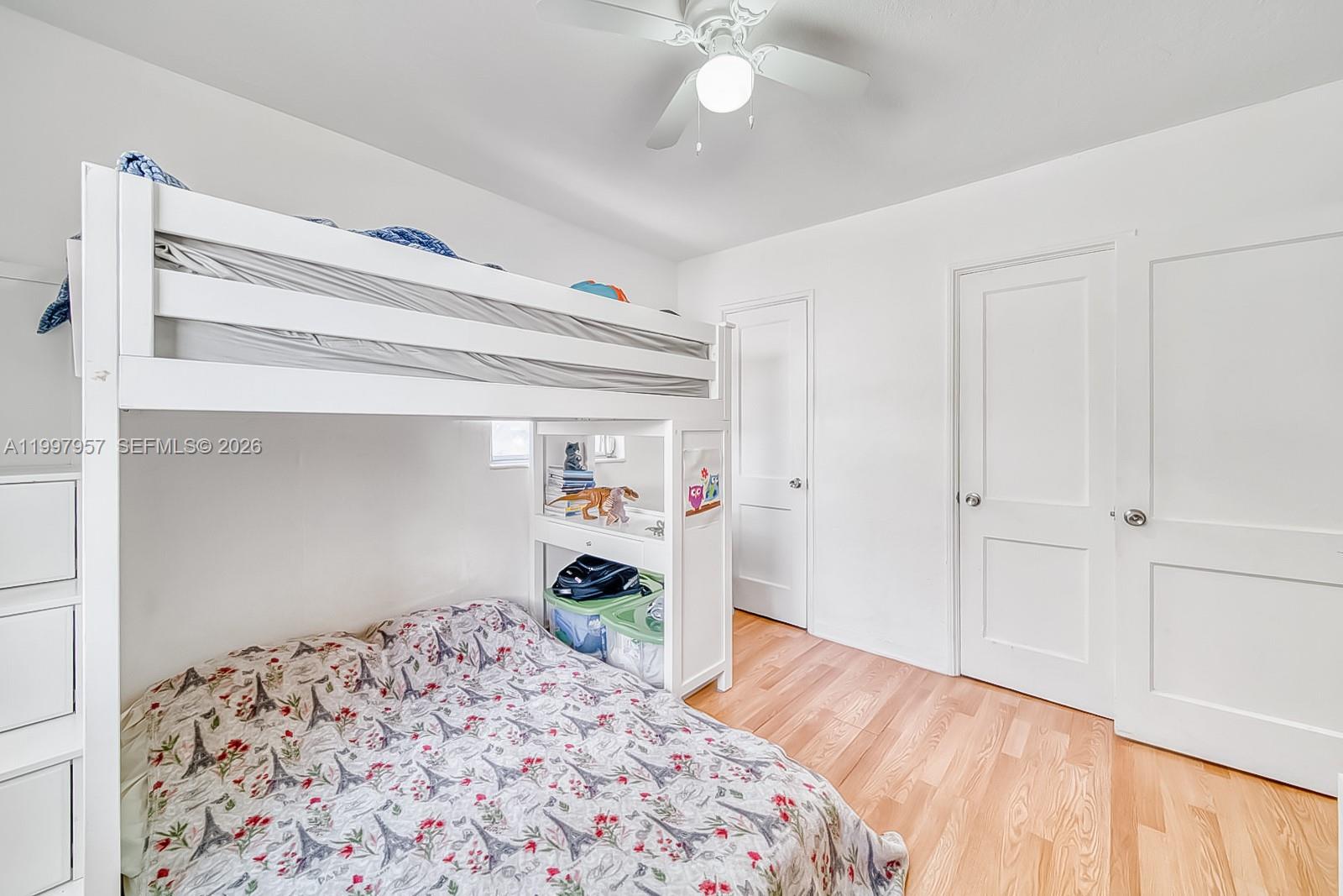 2171 Southwest 21st Street Miami, FL 33145 - Photo 25 of 31 a bedroom with a bed and a dresser in it