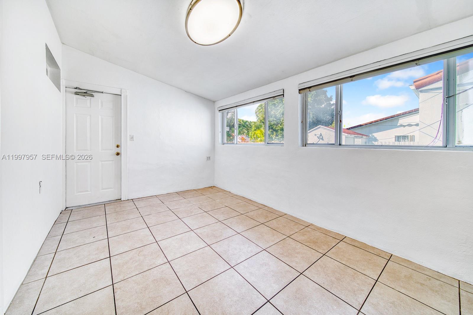 2171 Southwest 21st Street Miami, FL 33145 - Photo 30 of 31 a view of an empty room and window