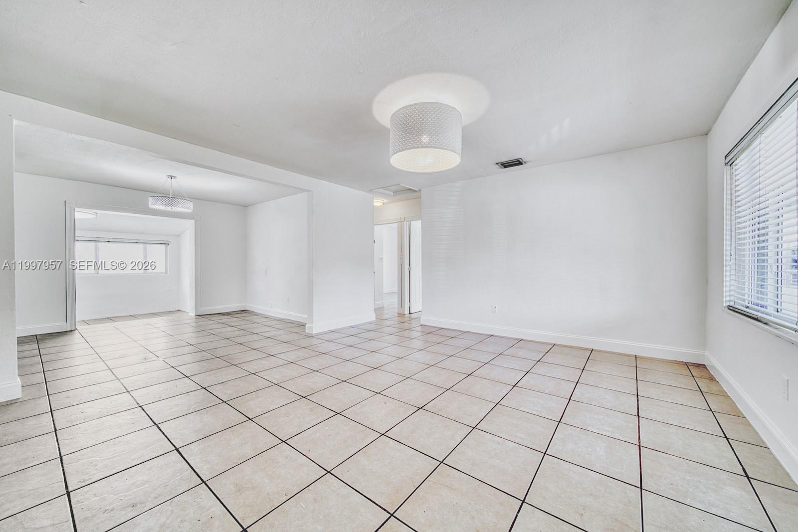 2171 Southwest 21st Street Miami, FL 33145 - Photo 8 of 31 a view of an empty room and window
