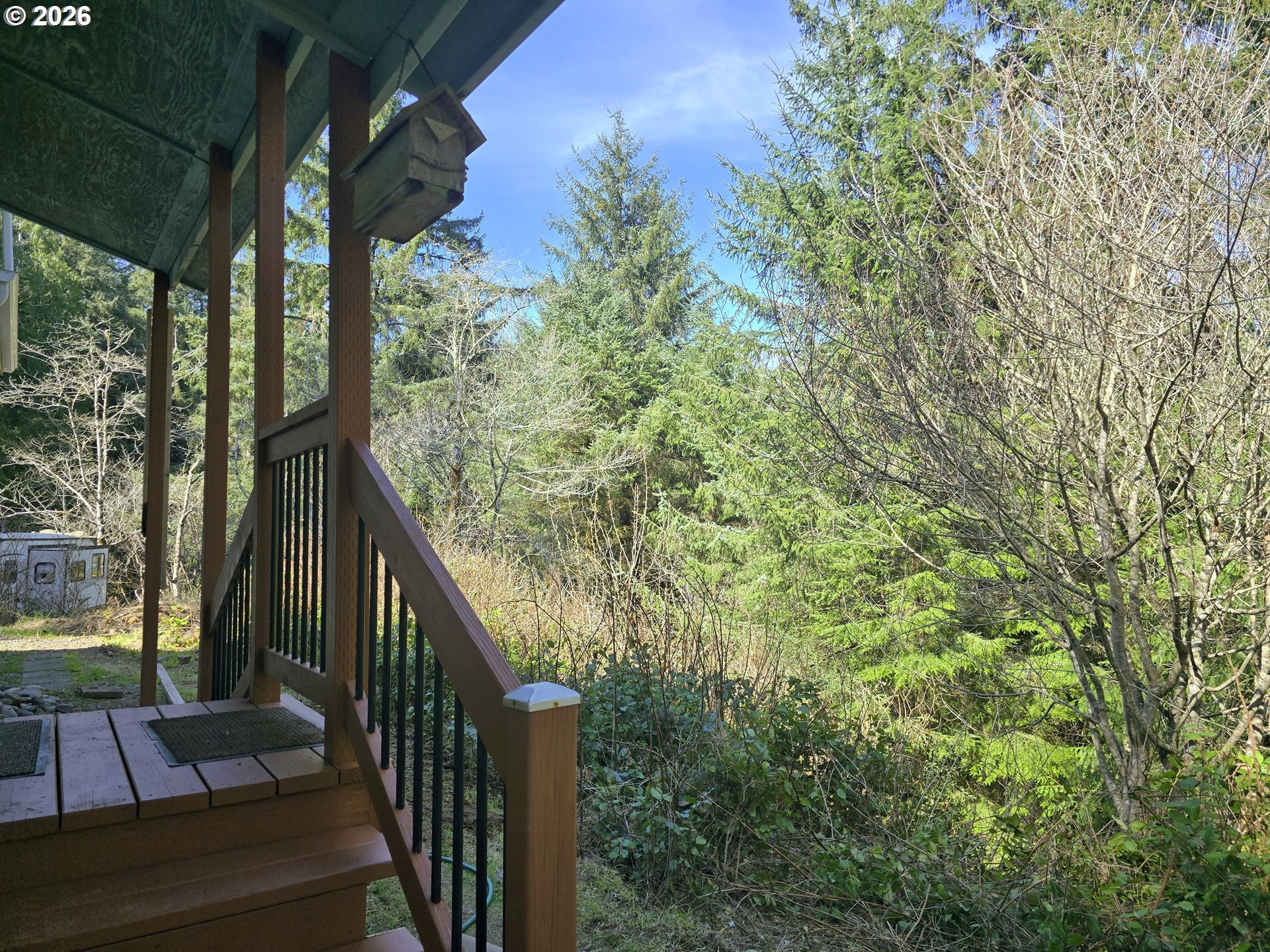 89491 Sutton Place Florence, OR 97439 - Photo 12 of 21 a view of balcony with wooden floor and fence
