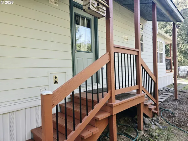 a view of a balcony with wooden floor