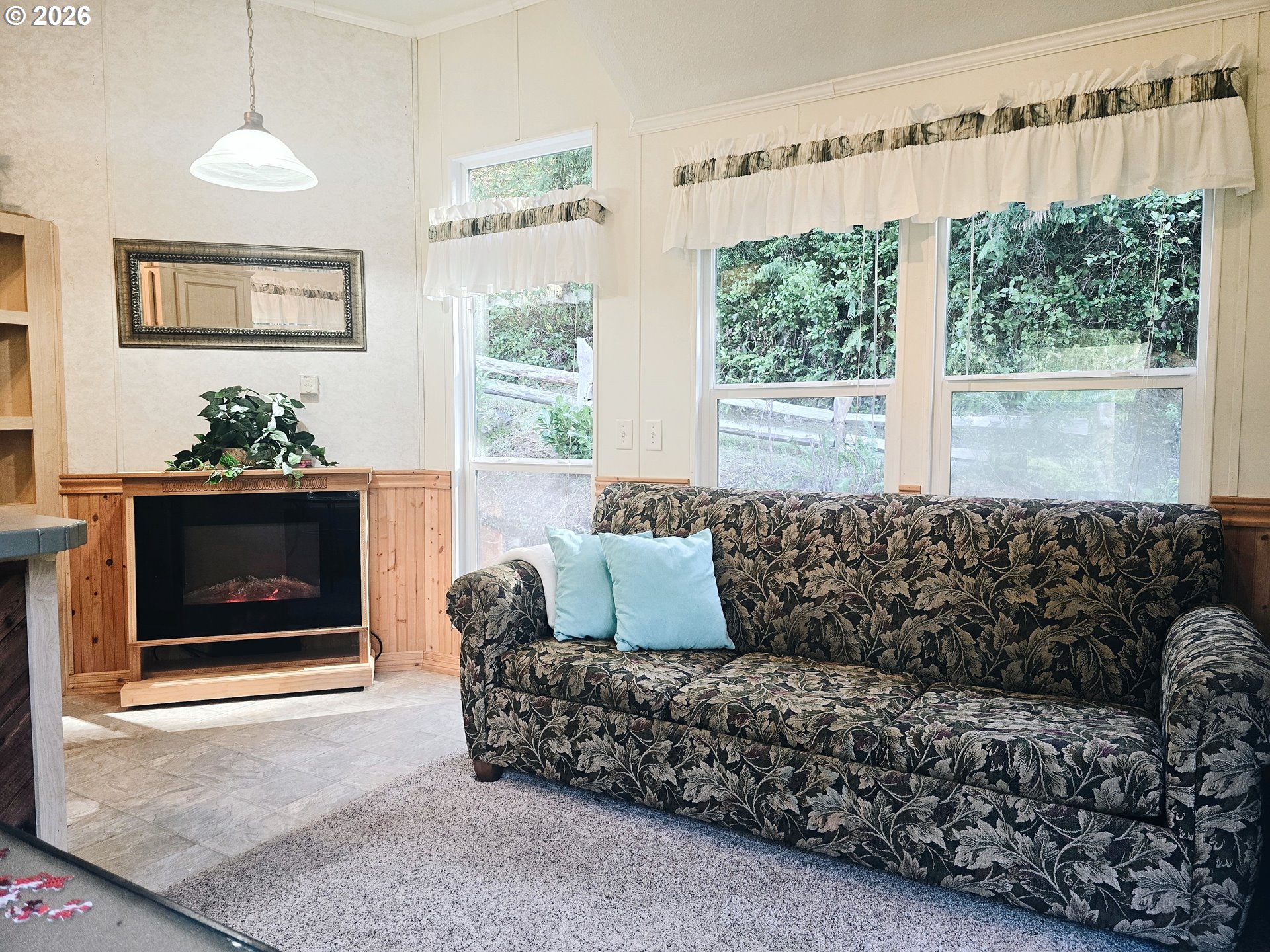 89491 Sutton Place Florence, OR 97439 - Photo 3 of 21 a living room with furniture and a fireplace