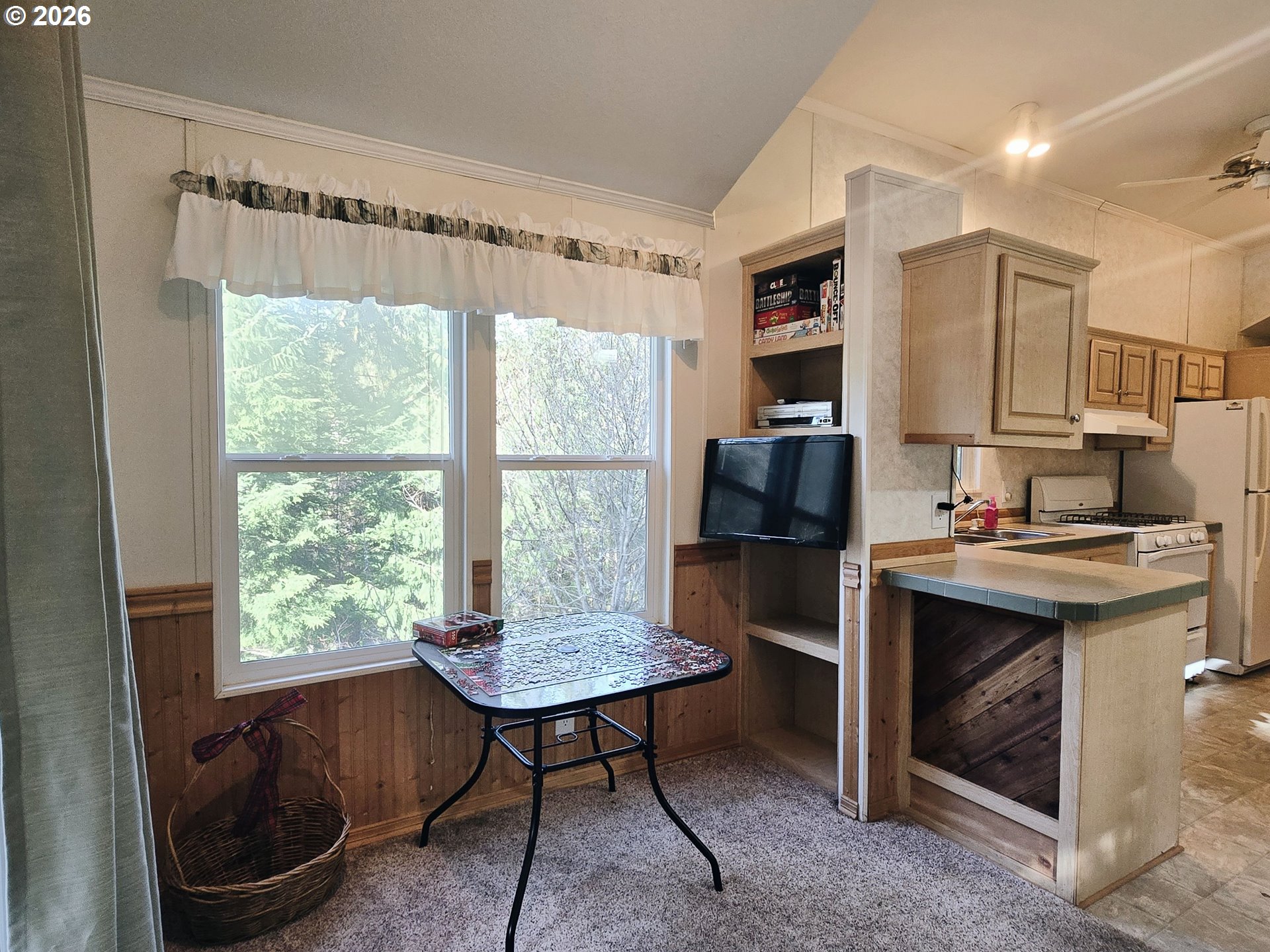 89491 Sutton Place Florence, OR 97439 - Photo 5 of 21 a kitchen with a sink a window and cabinets