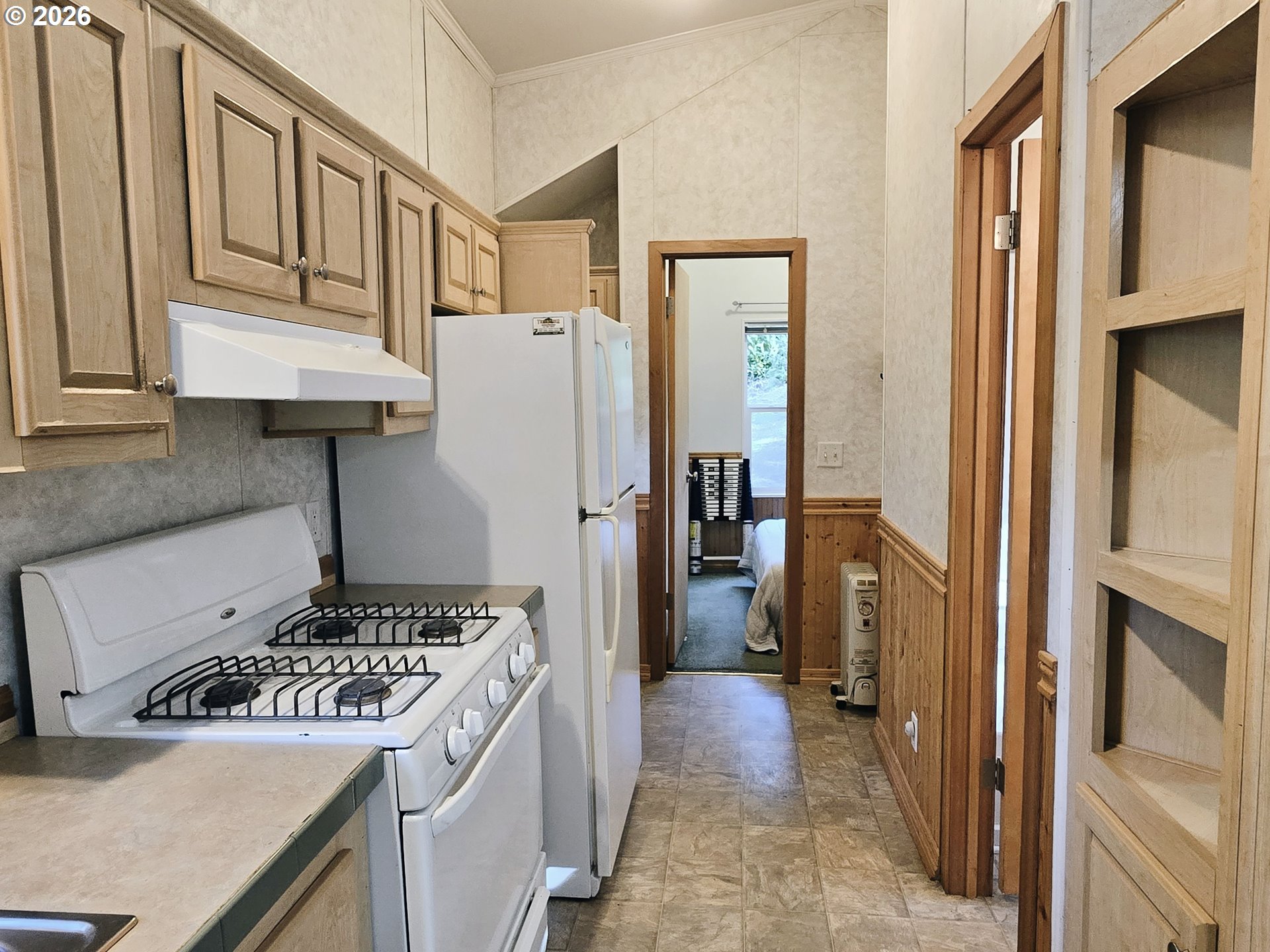 89491 Sutton Place Florence, OR 97439 - Photo 8 of 21 a kitchen with a refrigerator and a stove