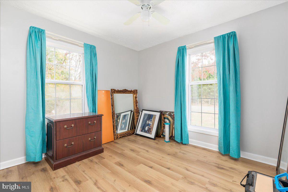 10346 Groves Farm Road Midland, VA 22728 - Photo 12 of 36 a bedroom with a bed and a dresser