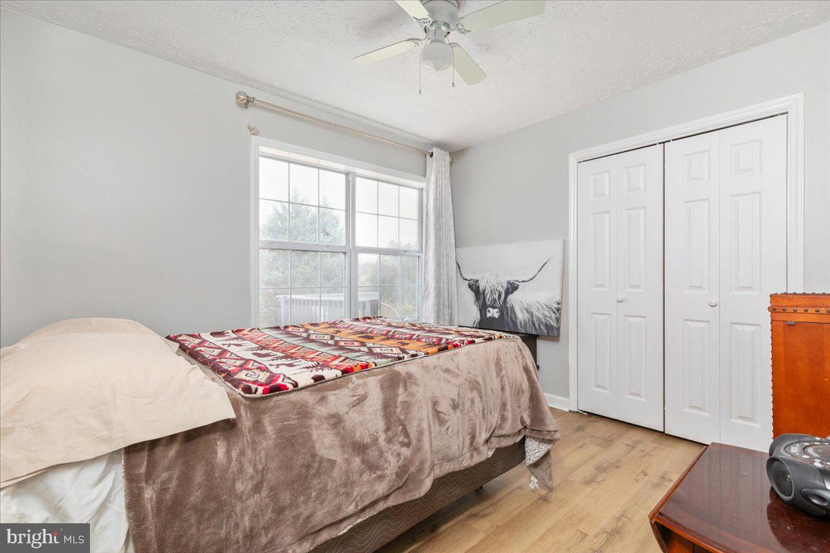 10346 Groves Farm Road Midland, VA 22728 - Photo 13 of 36 a bedroom with a bed and a window