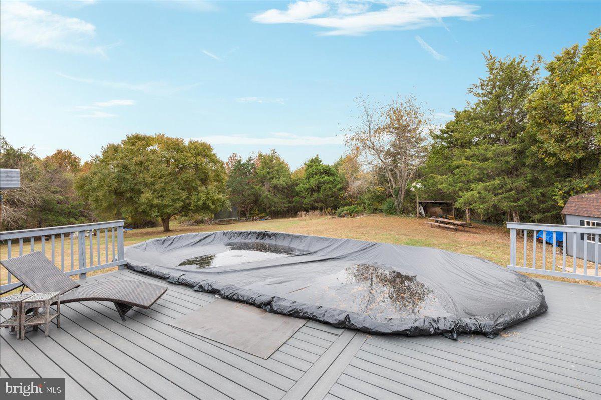 10346 Groves Farm Road Midland, VA 22728 - Photo 22 of 36 a view of a swimming pool with a lounge chair