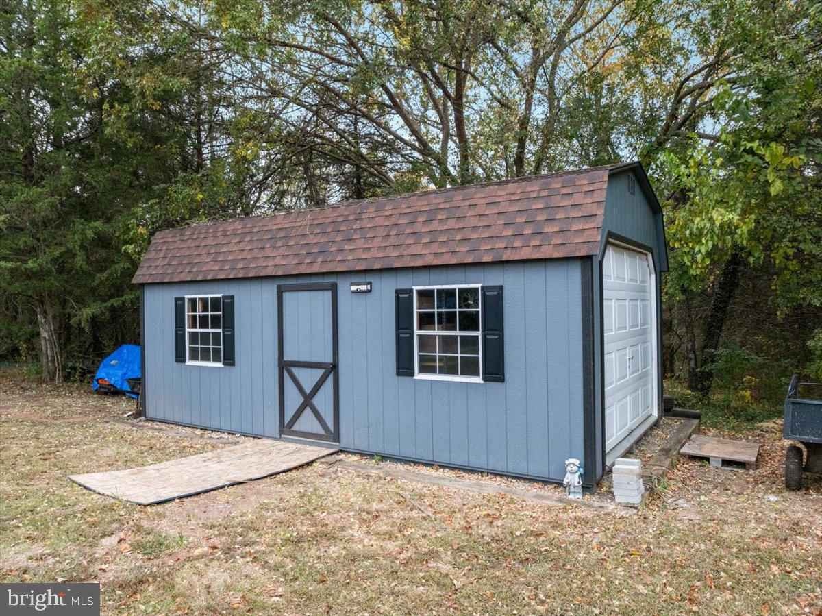 10346 Groves Farm Road Midland, VA 22728 - Photo 35 of 36 a backyard of a house with yard and outdoor seating