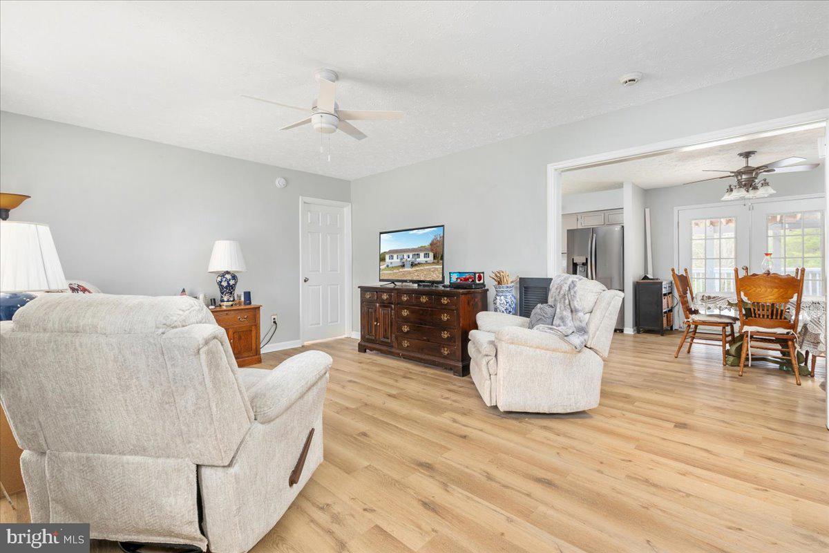 10346 Groves Farm Road Midland, VA 22728 - Photo 4 of 36 a bedroom with furniture and wooden floor