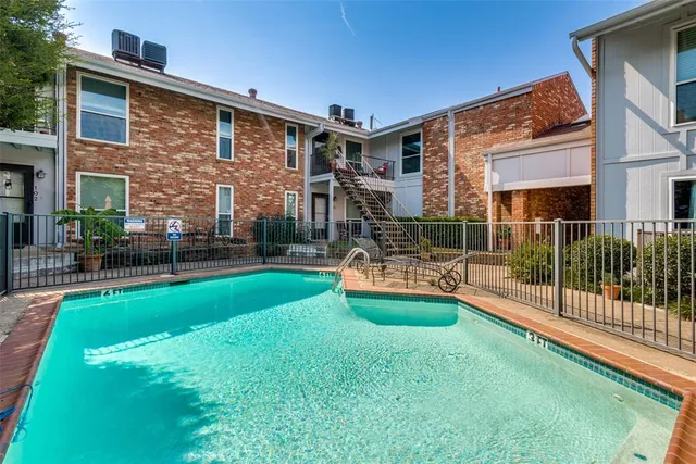 a view of a brick building from a balcony