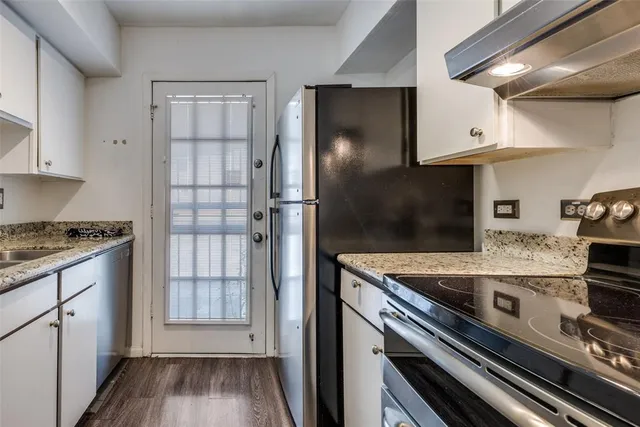 a kitchen with a sink a washer and dryer