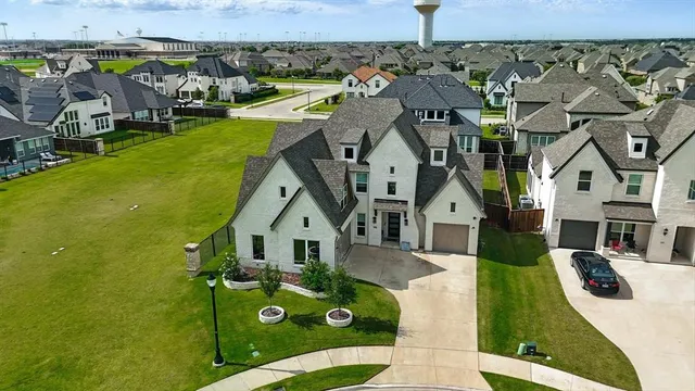 an aerial view of a house with swimming pool