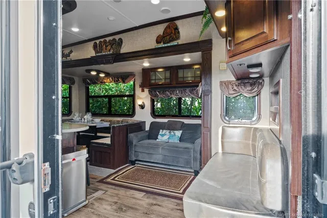 a living room with large windows