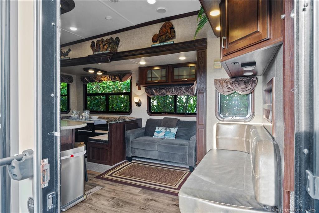 Undisclosed Address Jensen Beach, FL 34957 - Photo 15 of 47 a living room with large windows