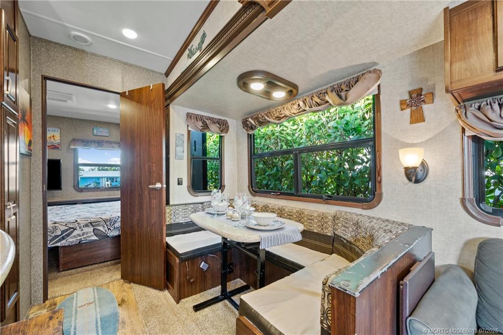 Undisclosed Address Jensen Beach, FL 34957 - Photo 16 of 47 a living room with furniture and a large window