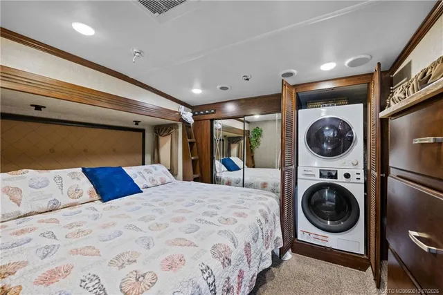a bedroom with a washing machine and a rug