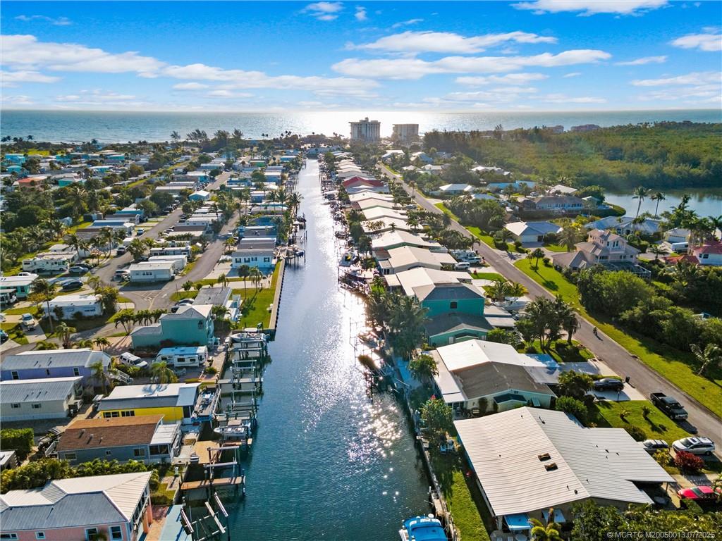 Undisclosed Address Jensen Beach, FL 34957 - Photo 23 of 47 an aerial view of residential houses with outdoor space