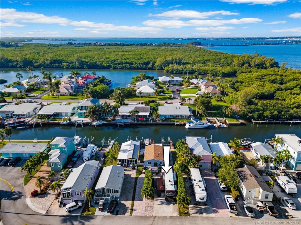 Undisclosed Address Jensen Beach, FL 34957 - Photo 24 of 47 a view of a lake with a car park in front of it