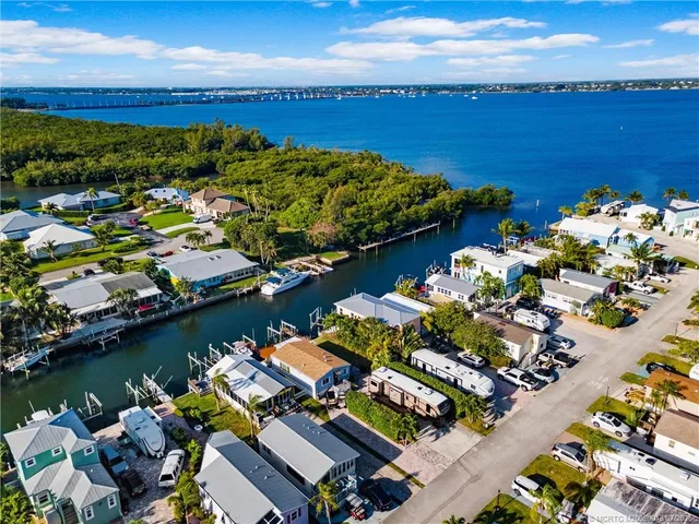 a view of a yard with wooden fence