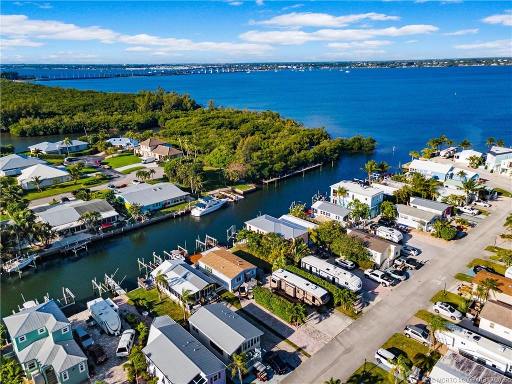 Undisclosed Address Jensen Beach, FL 34957 - Photo 26 of 47 view of a lake with lawn chairs