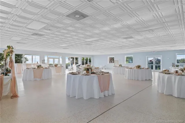 a room with furniture pool table table and chairs