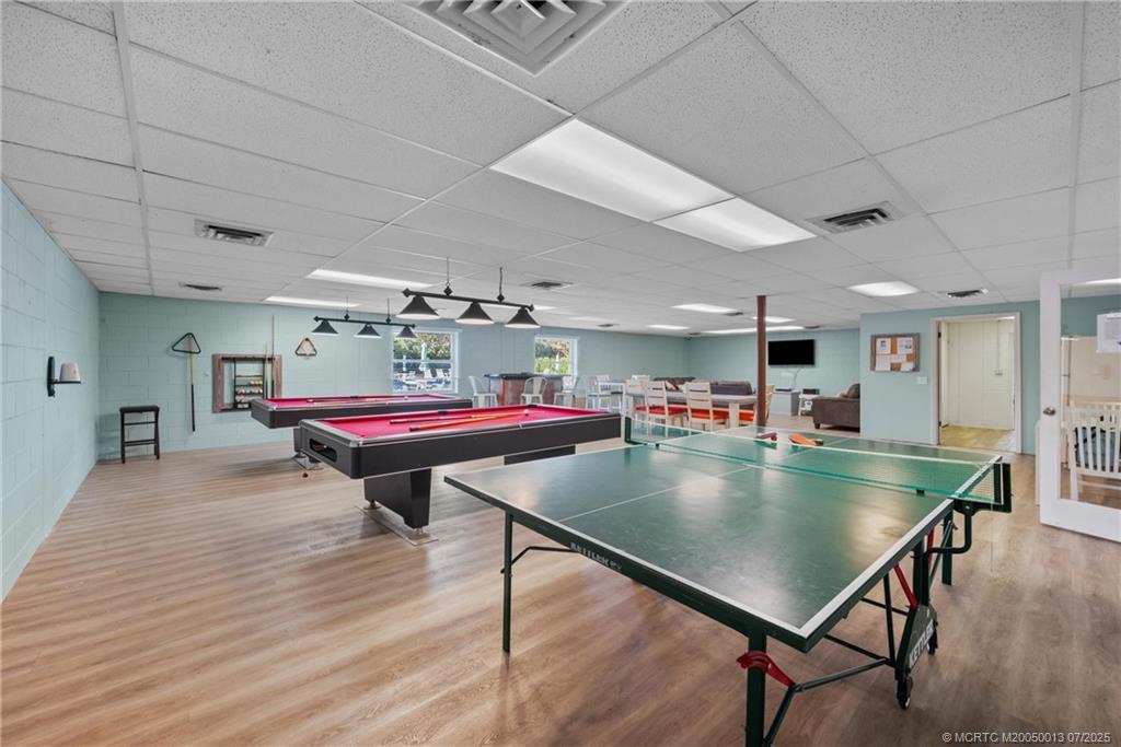 Undisclosed Address Jensen Beach, FL 34957 - Photo 31 of 47 a room with furniture pool table table and chairs