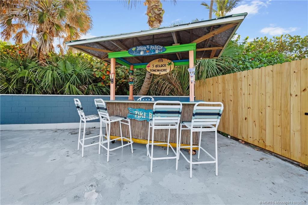 Undisclosed Address Jensen Beach, FL 34957 - Photo 38 of 47 a view of outdoor space with table and chairs